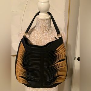 -Sergio Rossi leather shoulder bag in the most beautiful woven leather.